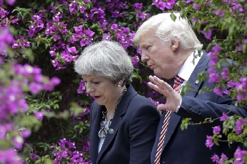 Trump accuses EU of robbing US as he delivers a new snub to May